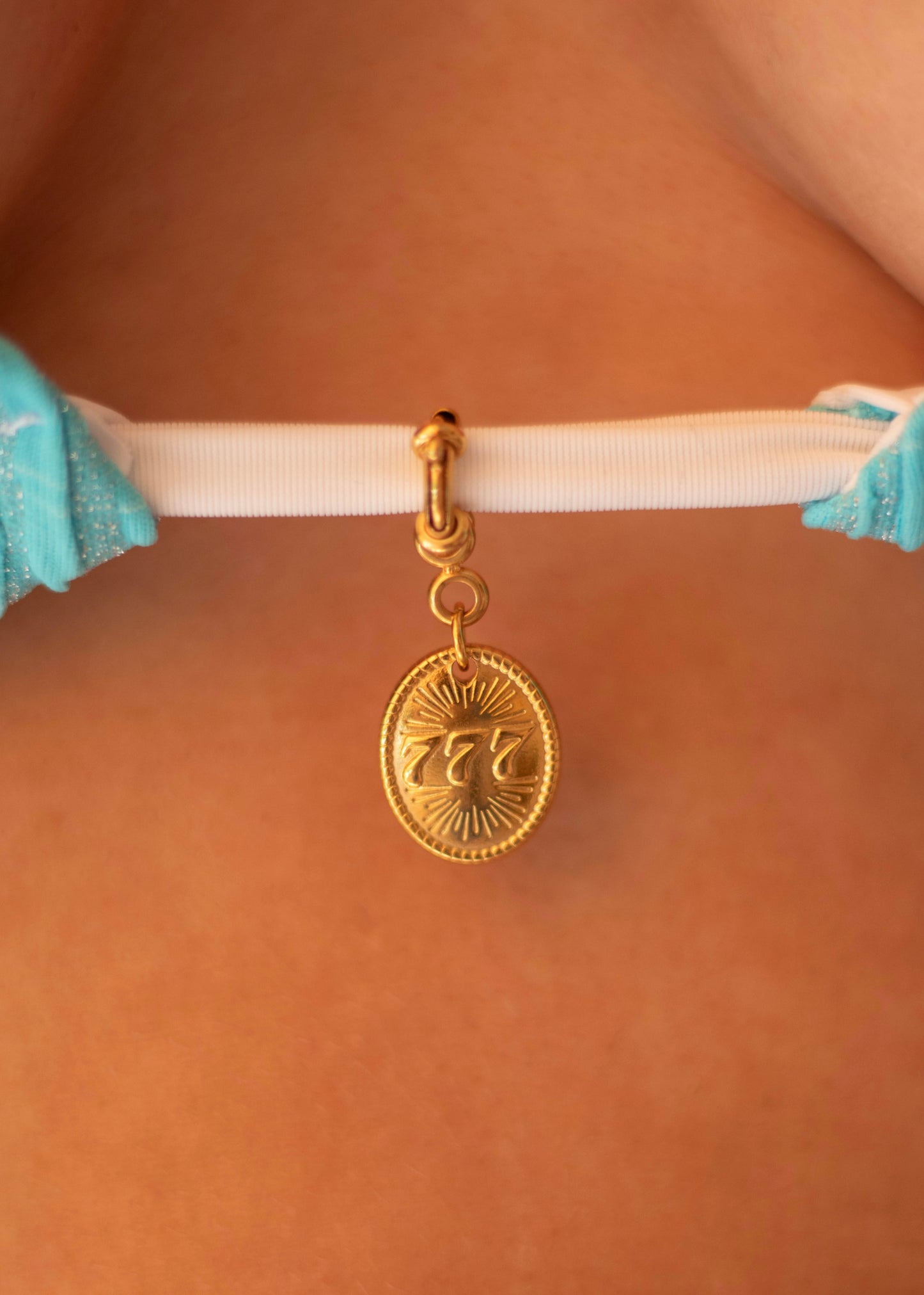 Pendentif central maillot de bain 777